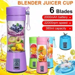 Fresh juice poured from personal blender into glass
