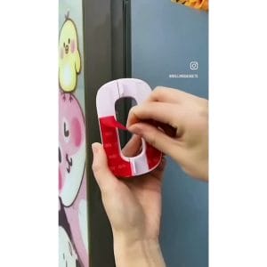 Close-up of childproof latch on refrigerator handle